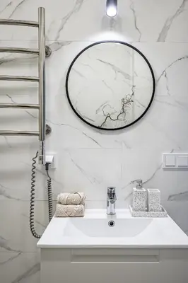 a bathroom with a sink and a mirror on the wall at Vilnius Old Town Studio Renessaince 5 in Vilnius