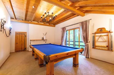 a pool table in a room with a ceiling at Friends & Family Getaway to Forest House by Reside Baltic in Samaka