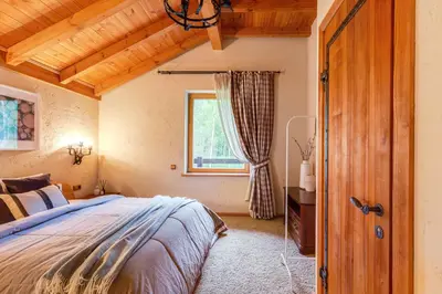 a bedroom with a bed and a window at Friends & Family Getaway to Forest House by Reside Baltic in Samaka
