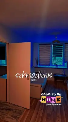 a room with a blue room with a table and a window at Ežero 8-90 in Šiauliai