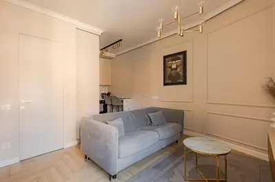 a living room with a couch and a table at TOP located NEW Stylish apartment in Vilnius Old Town in Vilnius