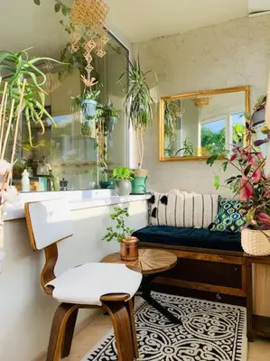 a bathroom with a sink and a bench with plants at Three bedroom with two terraces for 7people+baby in Kaunas