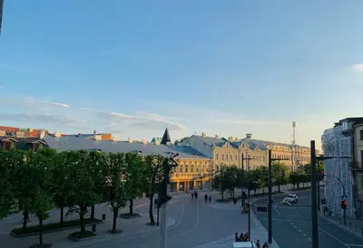a street in a city with buildings and trees at Three bedroom with two terraces for 7people+baby in Kaunas