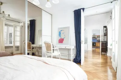 a bedroom with a mirror and a desk and a bed at Old town, Bright, Peaceful, Balcony, Netflix in Vilnius