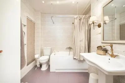 a bathroom with a tub and a toilet and a sink at Old town, Bright, Peaceful, Balcony, Netflix in Vilnius