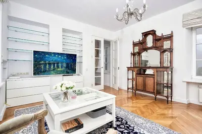 a living room with white walls and a tv at Old town, Bright, Peaceful, Balcony, Netflix in Vilnius