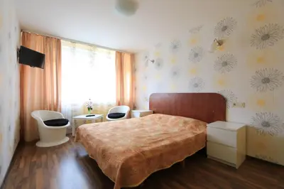 a bedroom with a bed and two toilets in it at Silvana in Vilnius