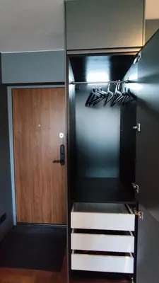 a small kitchen with a stove and a door at Dabintos Apartament Druskininkai in Druskininkai