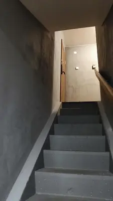 a stairway leading up to a door in a building at Dabintos Apartament Druskininkai in Druskininkai