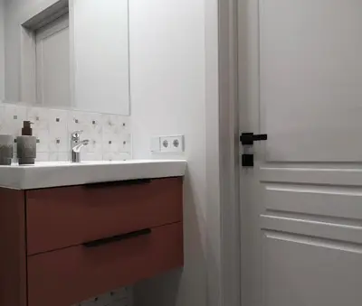 a bathroom with a sink and a mirror at Hill Top apartment in central Kedainiai in Kėdainiai