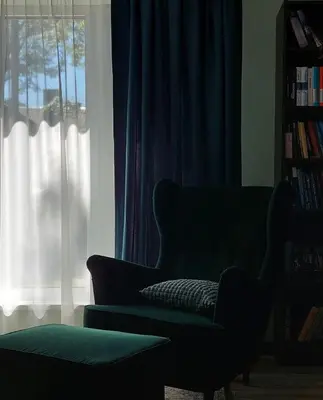 a living room with a couch and a window at Quiet place in Kaunas
