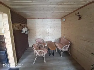 a room with chairs and a table in a room at Užupio namai in Anykščiai