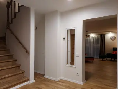 an empty living room with a staircase and a living room at Gelvadiskes Forest in Vilnius
