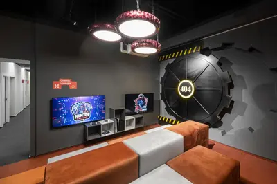 a living room with a couch and a tv at Youston self check-in coliving Vilnius in Vilnius