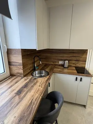 a kitchen with a sink and a counter top at 16 Airport Apartment in Vilnius