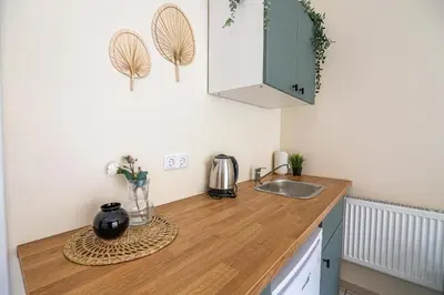 a kitchen with a sink and a counter top at The house Kaunas in Kaunas