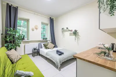 a living room with a couch and a table at The house Kaunas in Kaunas
