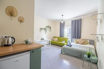 a living room with a bed and a couch at The house Kaunas in Kaunas