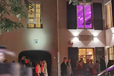 a group of people standing outside of a building at Medieval Super Studio in Vilnius