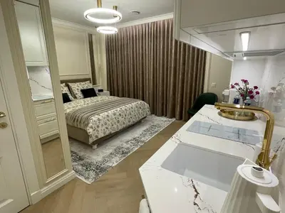 a bedroom with a bed and a large mirror at ART Uzupis Apartment in City center in Vilnius