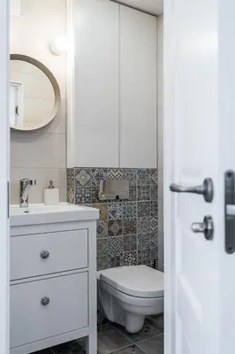 a bathroom with a toilet and a sink and a mirror at Butas nuomai Šiauliuose in Šiauliai