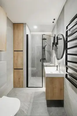 a bathroom with a shower and a sink and a mirror at Brand New Mindaugas Luxury Designer Apart in Vilnius