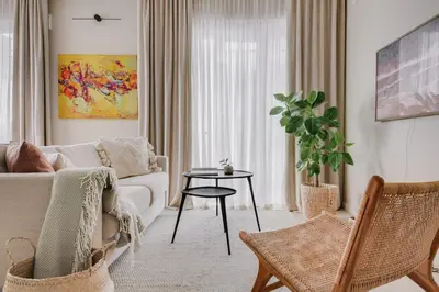 a living room with a couch and chairs and a table at #stayhere - Brand New Unique Designer 1BDR in Trendy Neighbourhood in Vilnius