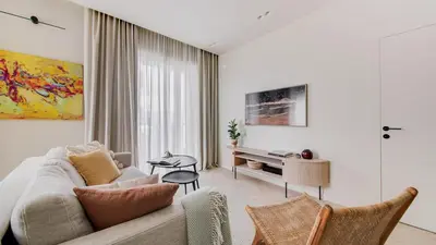 a living room with a couch and a table at #stayhere - Brand New Unique Designer 1BDR in Trendy Neighbourhood in Vilnius