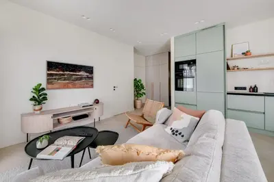 a living room with a couch and a table at #stayhere - Brand New Unique Designer 1BDR in Trendy Neighbourhood in Vilnius