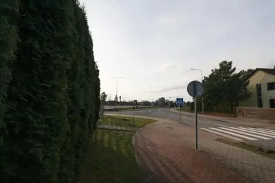 a stop sign on the side of a street at Apartamentai Aqua in Druskininkai