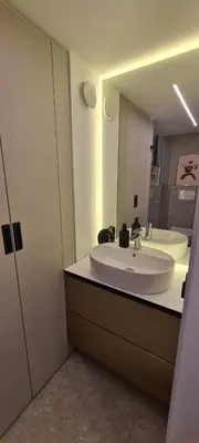 a bathroom with a white sink and a mirror at Stay in Kaunas & Radio City in Kaunas