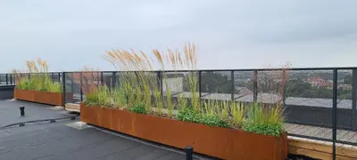 a balcony with a fence and plants on it at Stay in Kaunas & Radio City in Kaunas