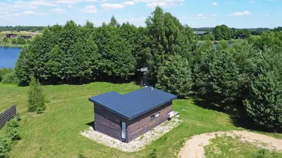 an overhead view of a small building on a field at Pineplace in Joniškis