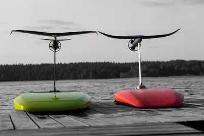 two kayaks sitting on top of a dock at Viesuliškės Lakeside Glamping in Lakaja