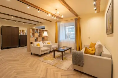 a living room with a couch and chairs and a table at Taurakalnis apartment in Vilnius