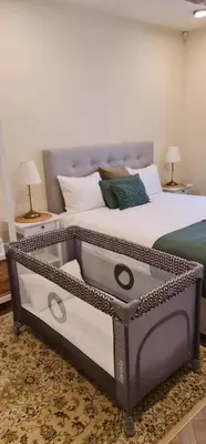 a bedroom with a large bed with a metal frame at Taurakalnis apartment in Vilnius