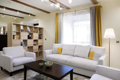 a living room with a couch and two chairs and a table at Taurakalnis apartment in Vilnius