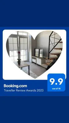 a picture of a room with a spiral staircase at Radio city loft in Kaunas