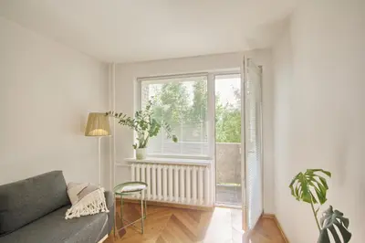 a living room with a couch and a window at Modern and cozy flat in Druskininkai