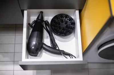 a black computer mouse in a white box at Vingriu Street Apartment by Reside Baltic in Vilnius