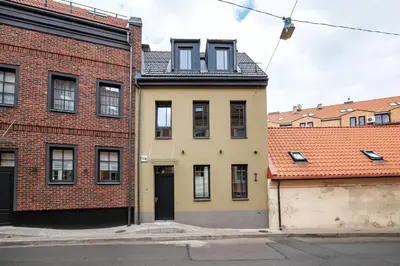 an apartment building in the middle of two buildings at Vingriu Street Apartment by Reside Baltic in Vilnius