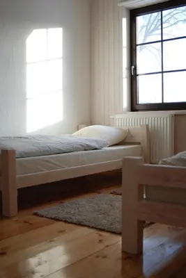 a bed in a room with a window at Dzūkijos uoga in Viršurodukis