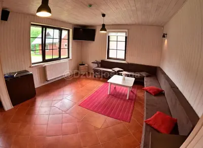 an overhead view of a living room with a table at Dzūkijos uoga in Viršurodukis