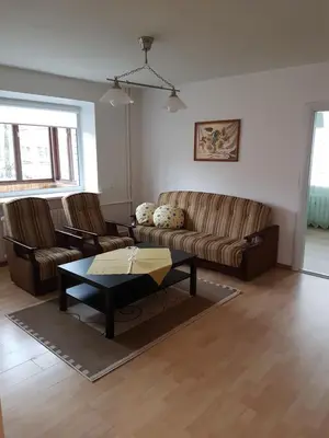 a living room with a couch and a coffee table at Apartments in Panevezys city center in Panevėžys