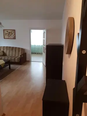 a living room with a couch and a table at Apartments in Panevezys city center in Panevėžys