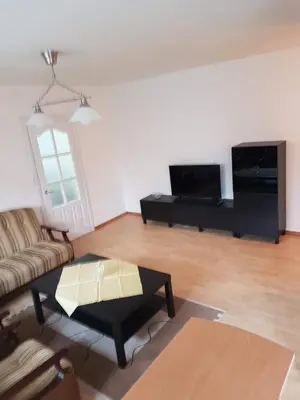 a living room with a couch and a coffee table at Apartments in Panevezys city center in Panevėžys