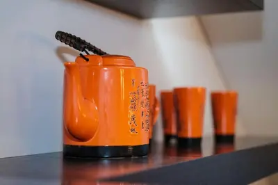 an orange pair of boots sitting on a shelf at #stayhere - Spacious Luxury Town Hall 3BDR Apartment in Vilnius