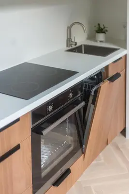a kitchen with a sink and a stove at #stayhere - Elegant & Light 1BDR apartment Vilnius Old Town in Vilnius