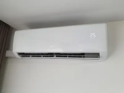 a white microwave oven sitting on top of a ceiling at Talsa 1-bedroom apartment in city center Šiauliai in Šiauliai