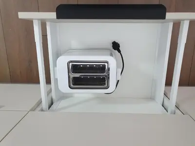 a toaster oven sitting on a white shelf at Talsa 1-bedroom apartment in city center Šiauliai in Šiauliai